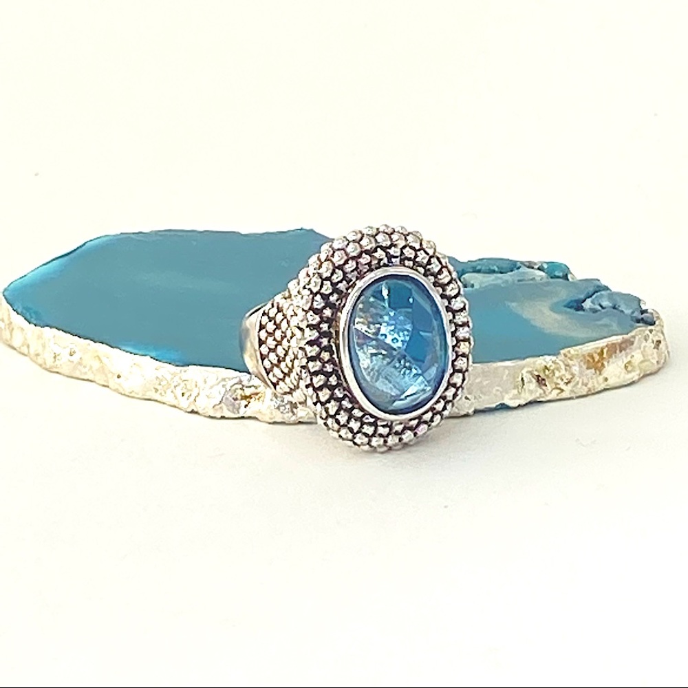 Silver plated and blue glass ring. Size 9.